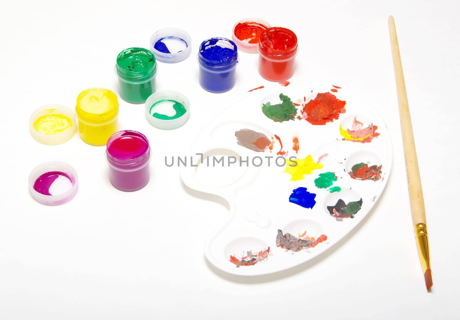 Palette with different colors isolated on white