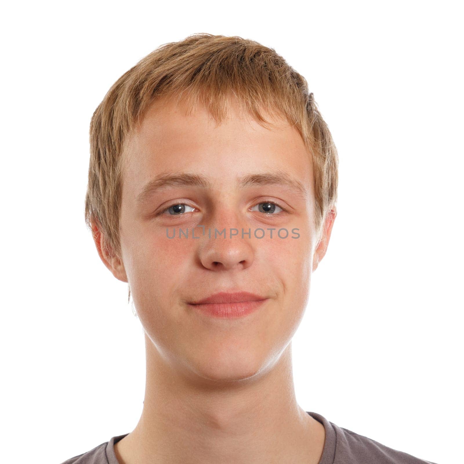 A smiling light brown haired male teenager