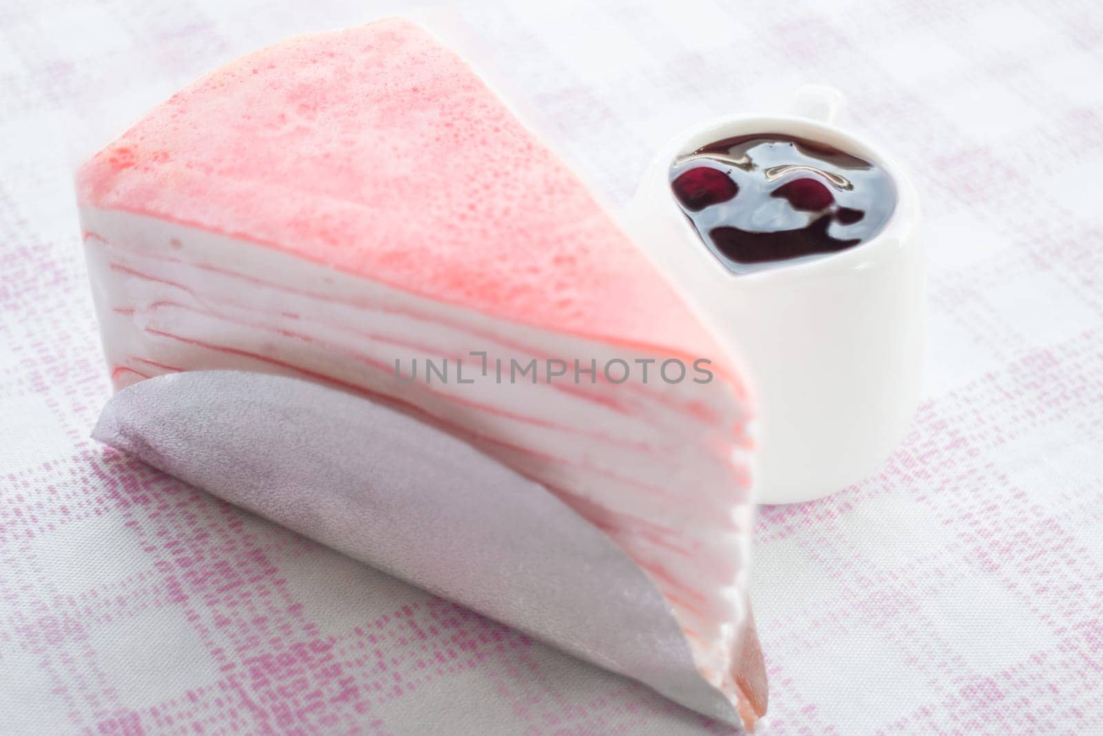 Delicious crepe cake and blueberry sauce, stock photo