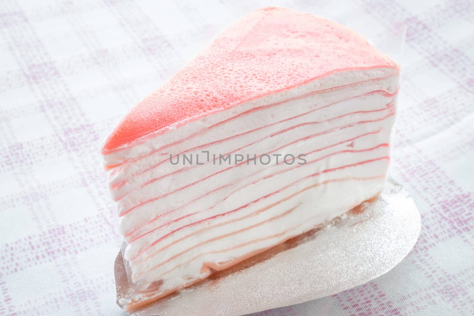 Close up delicious pink crepe cake, stock photo