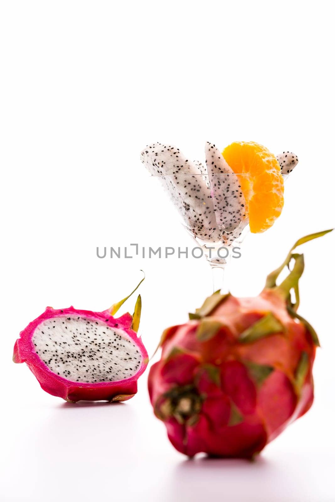 The slightly leafy rind and vibrant purple color of the pitaya is giving this exotic fruit its dragon-like appearance,from which the name dragonfruit is derived..