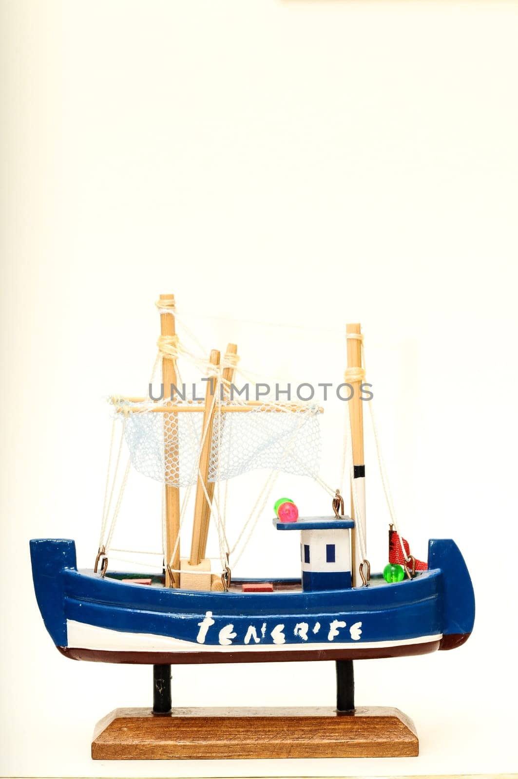 Beautiful miniature ship. Wooden sailship figurine. Antique model sailing boat isolated on white