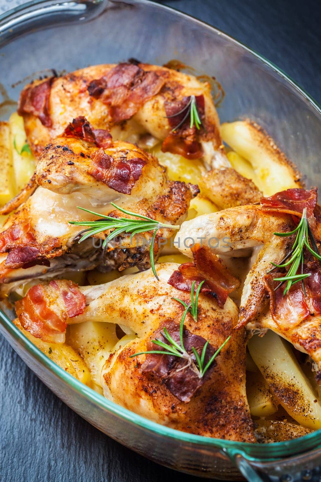 Baked chicken with potatoes and herbs