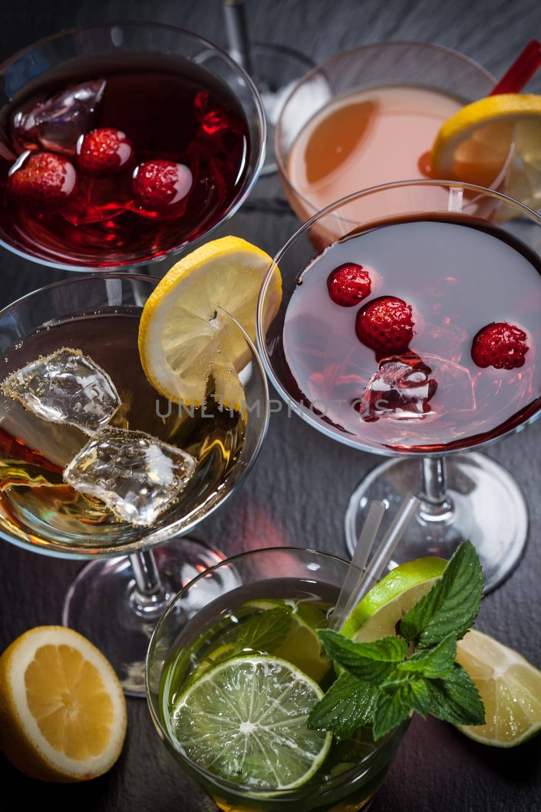 Party cocktails and longdrinks garnished with fruits for summer