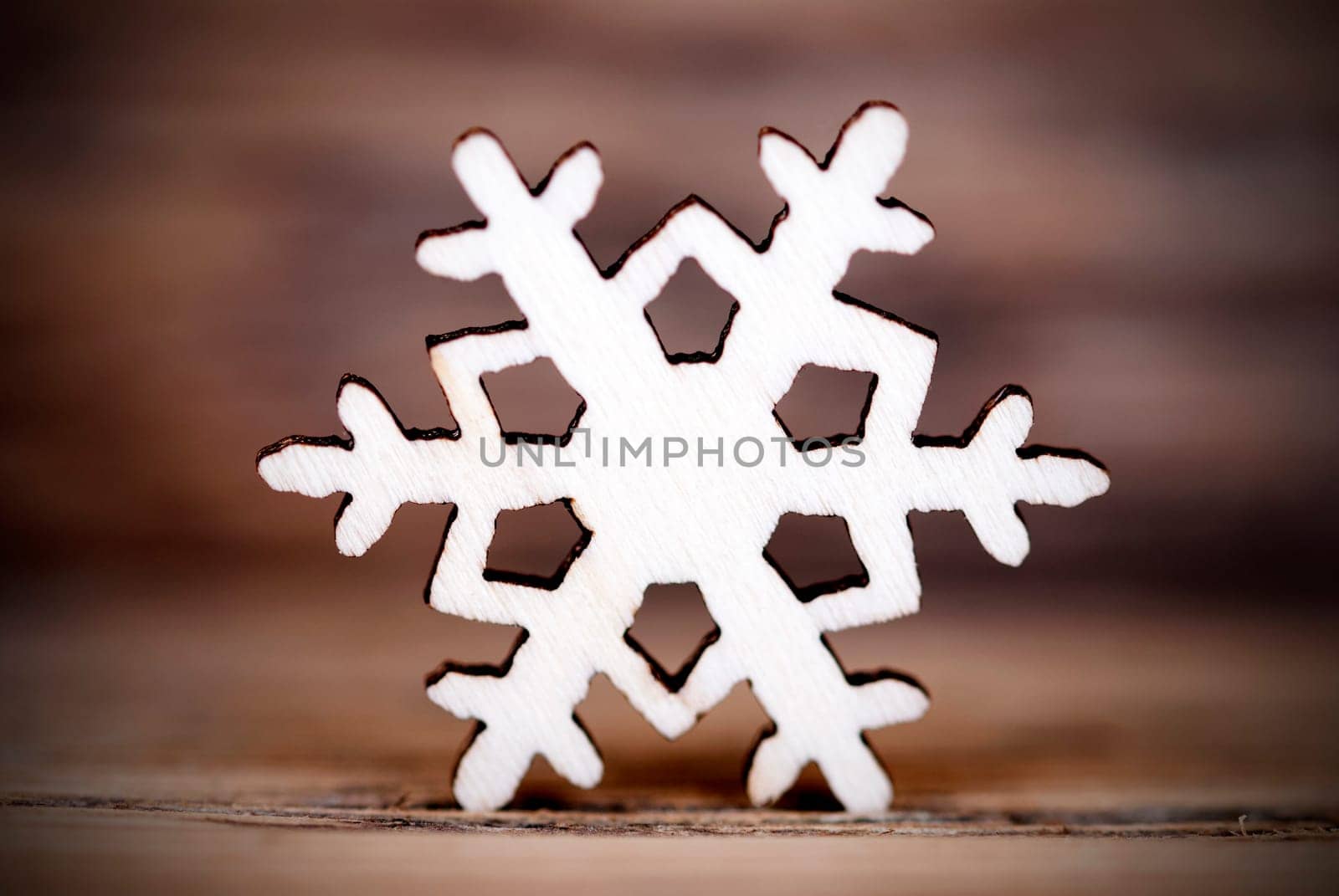 A Single Snowflake on Wood, Winter Background