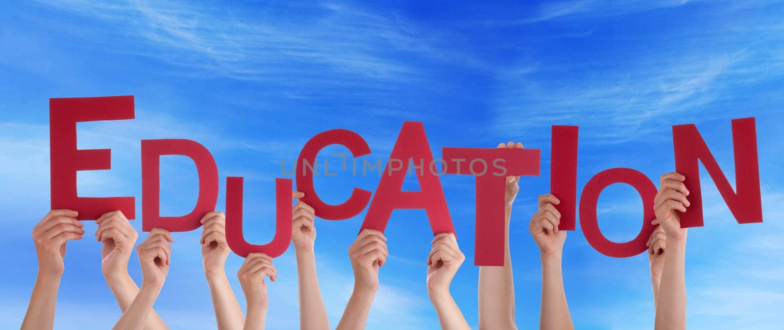 hands holding four pieces of a puzzle with copy space, gray background