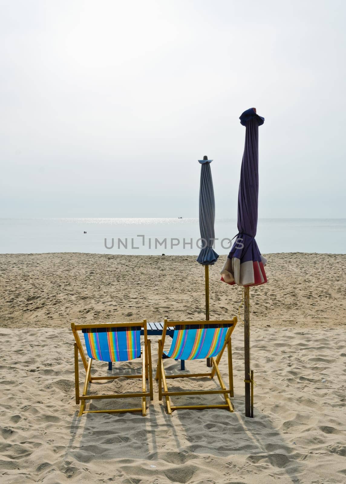 Couple of colorful chairs on beach, Thailand
