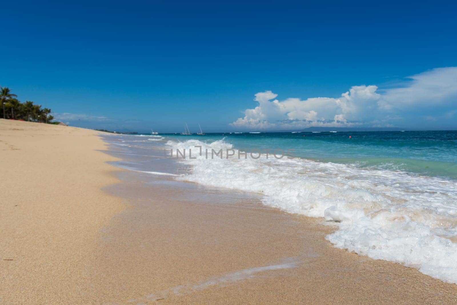 Beautiful secluded sandy beach in the Caribbean with white sand and blue sky as in paradise