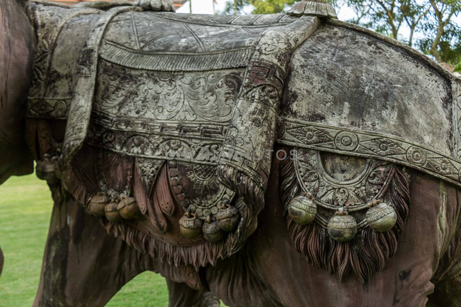 Realistic statue of a bronze elephant in a park in Bali