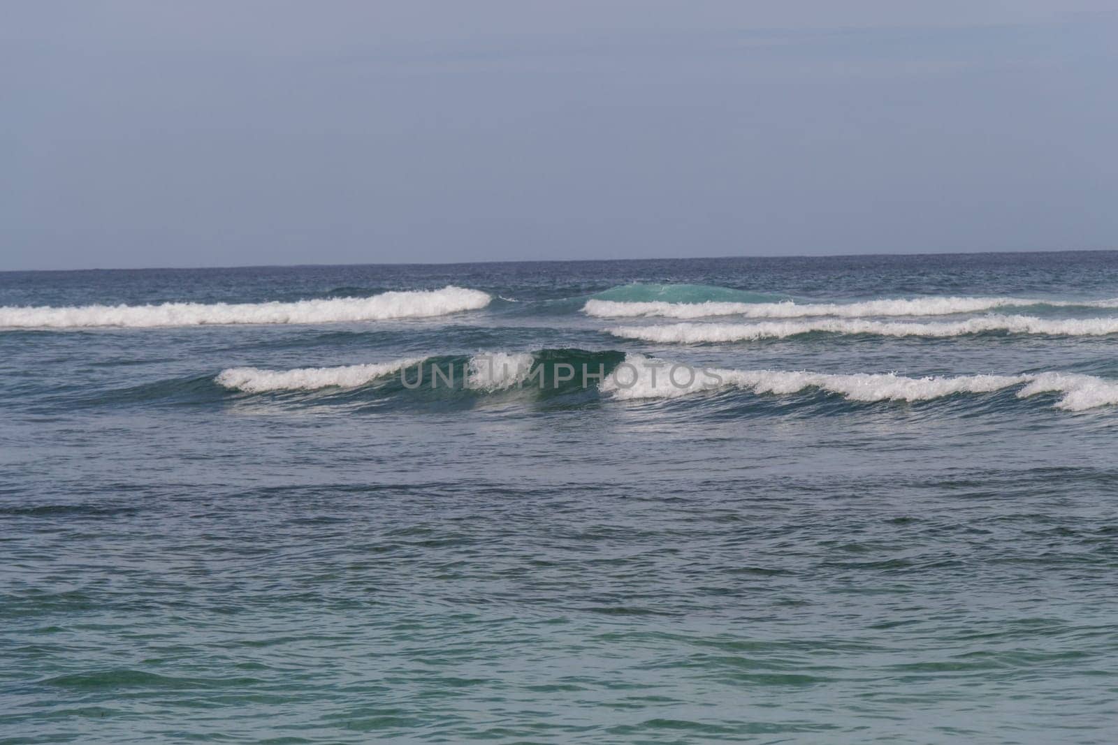 Beautiful secluded sandy beach in the Caribbean with white sand and blue sky as in paradise