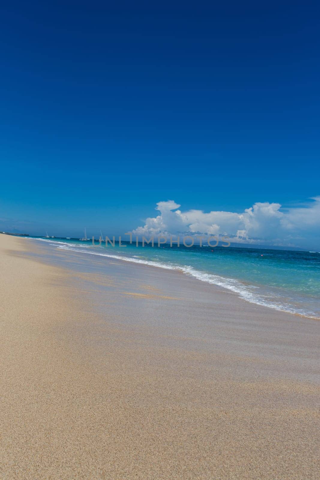 Beautiful secluded sandy beach in the Caribbean with white sand and blue sky as in paradise