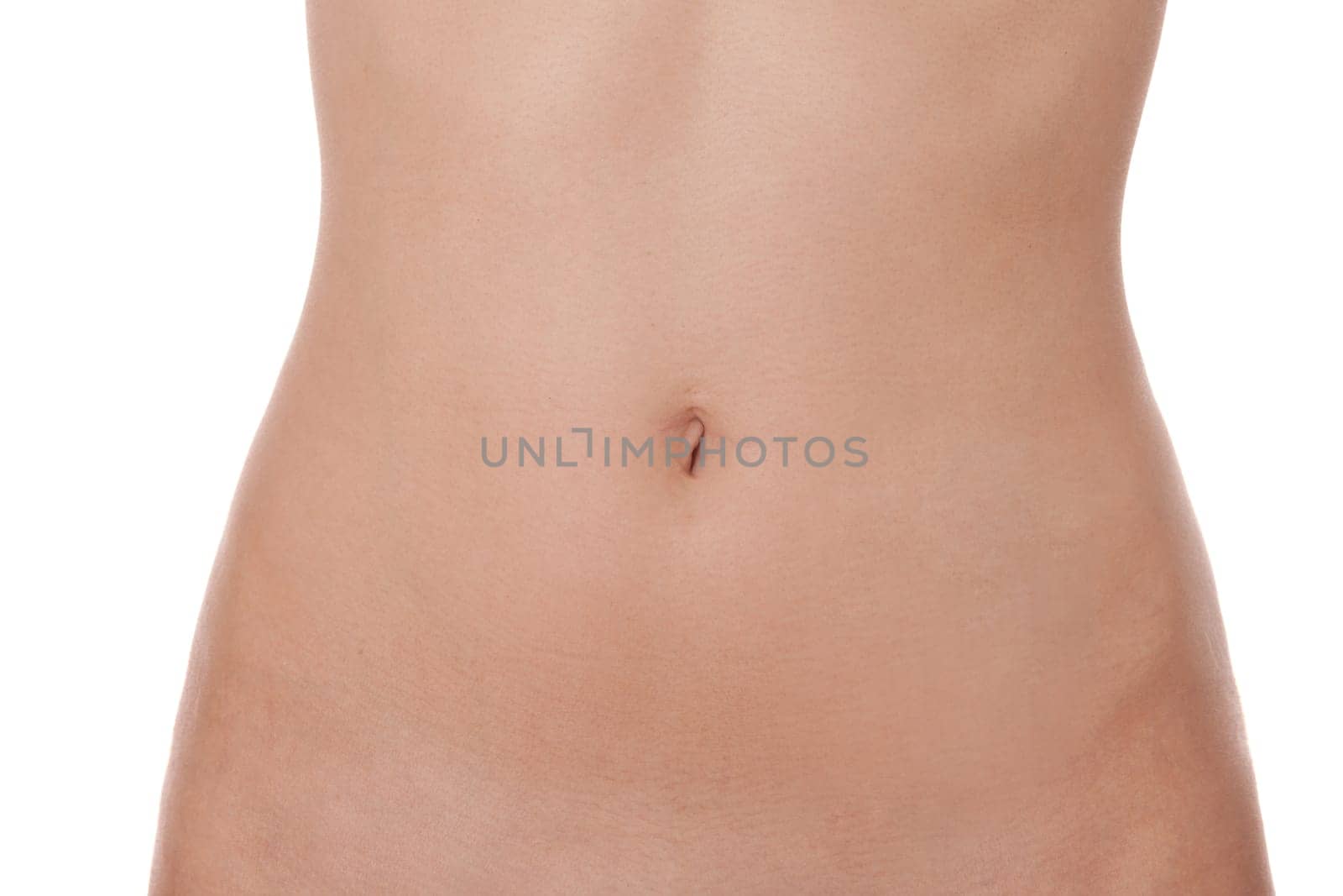 Close-up of a female abdomen from the hip to the chest isolated against a white background