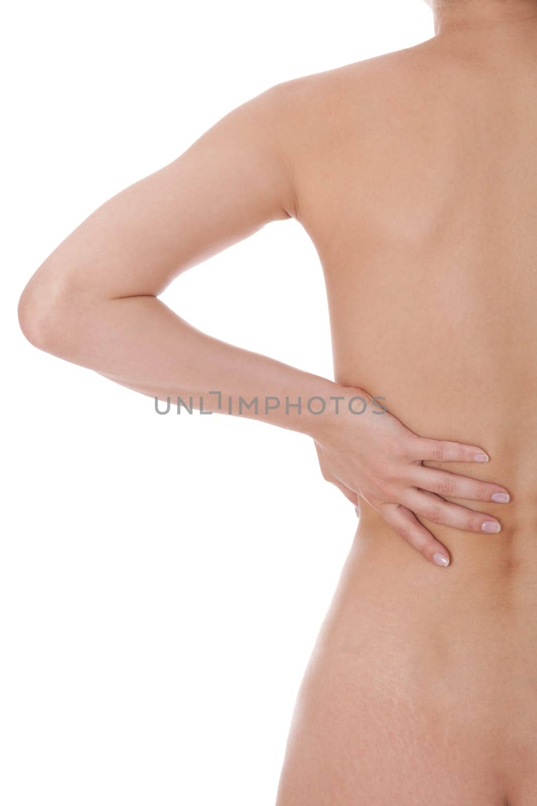 Young attractive woman grabs with her hands on her back bodypart isolated voe white background