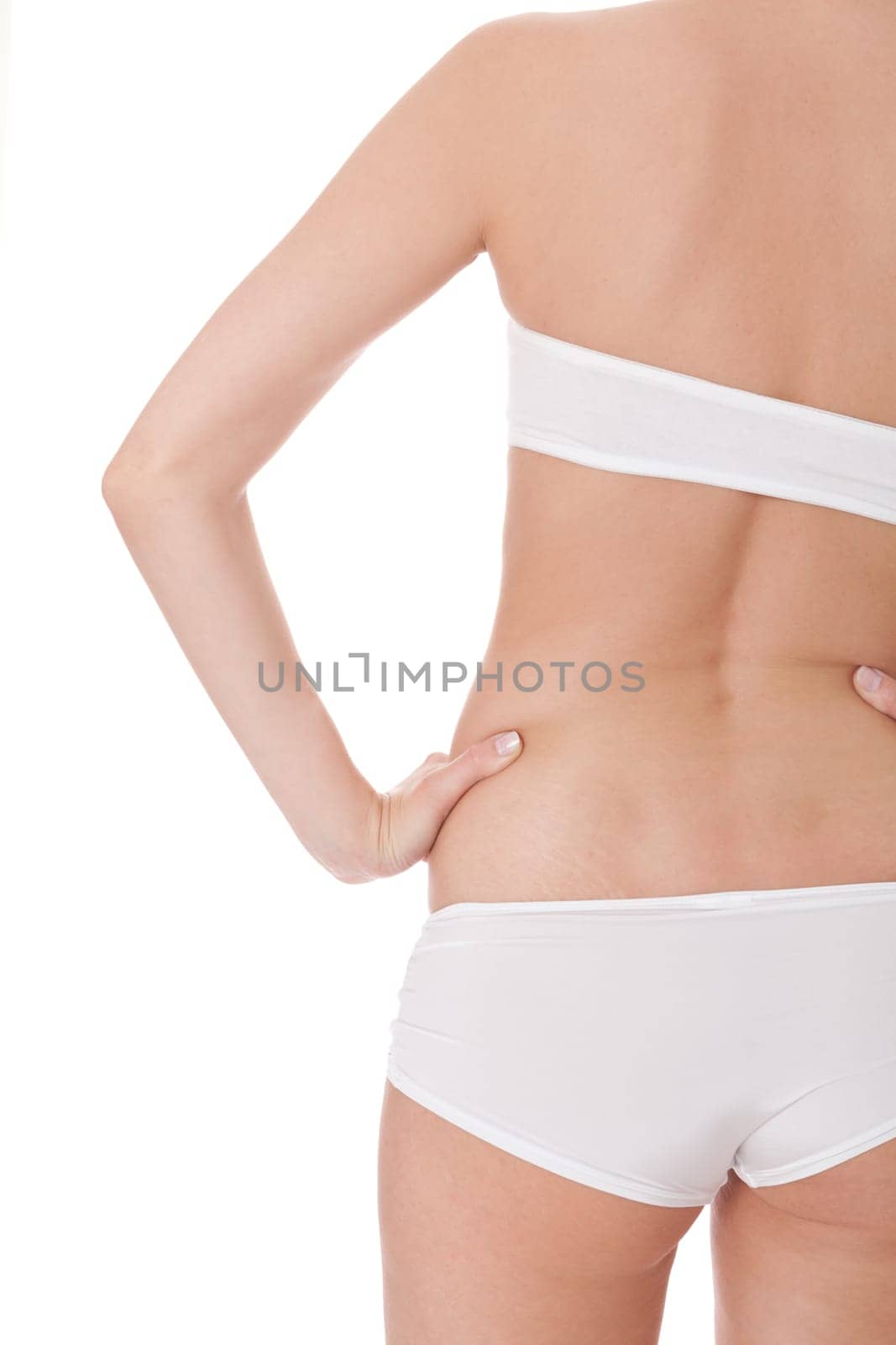 attractive sexy woman's body in white underwear with briefs and bra insulated against white background