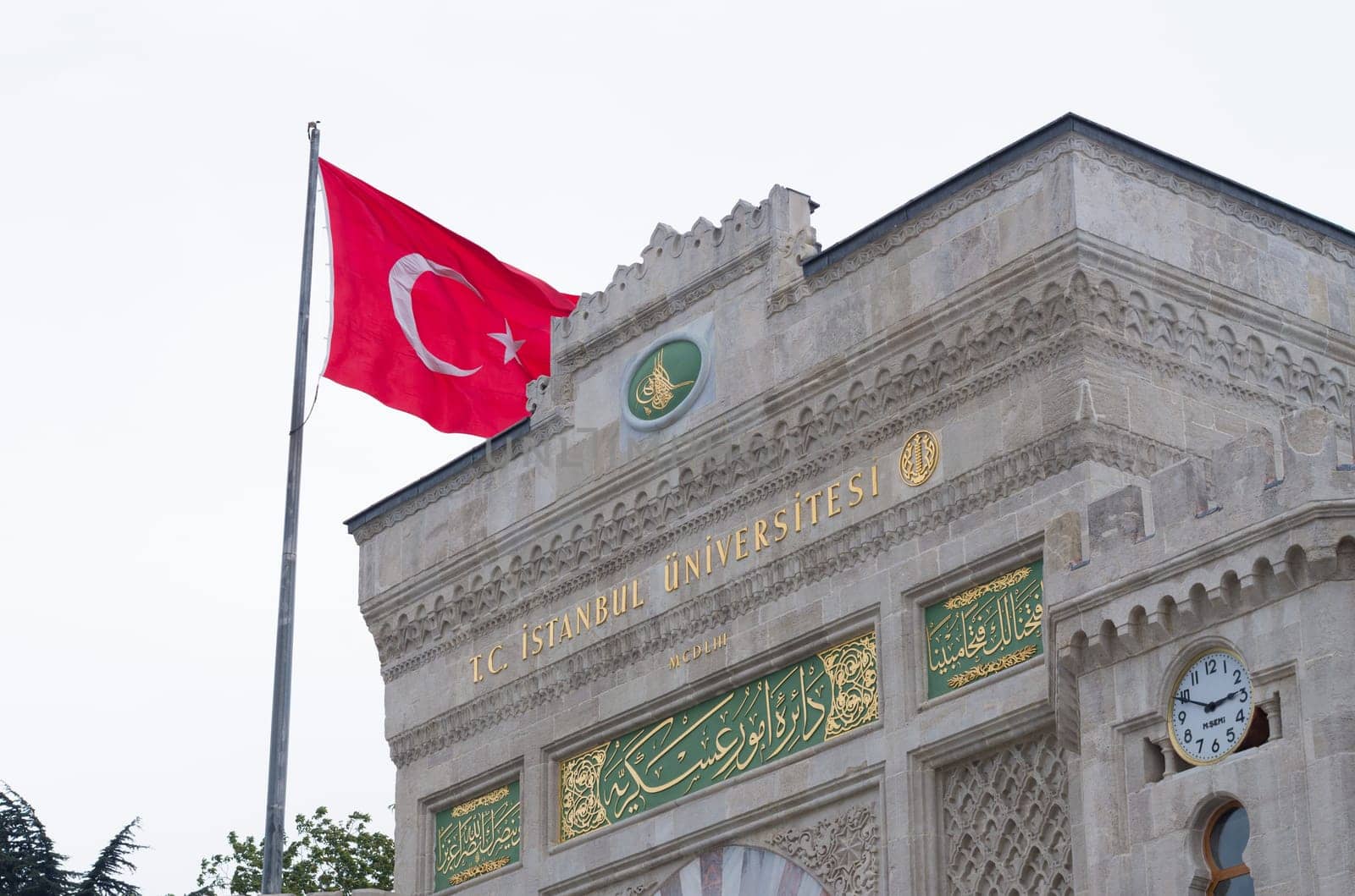 entrance gate of the istanbul university with turkish flag