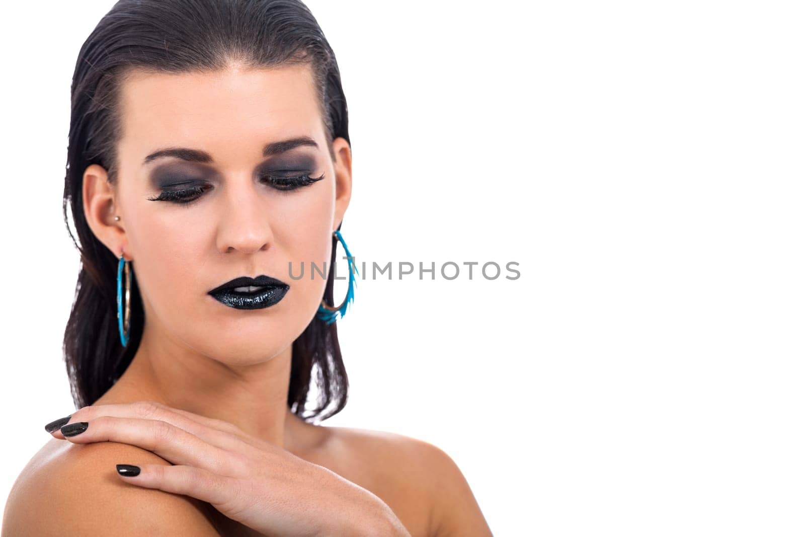 attractive young woman with black hair blue eyes and black makeup lips nail polish portrait