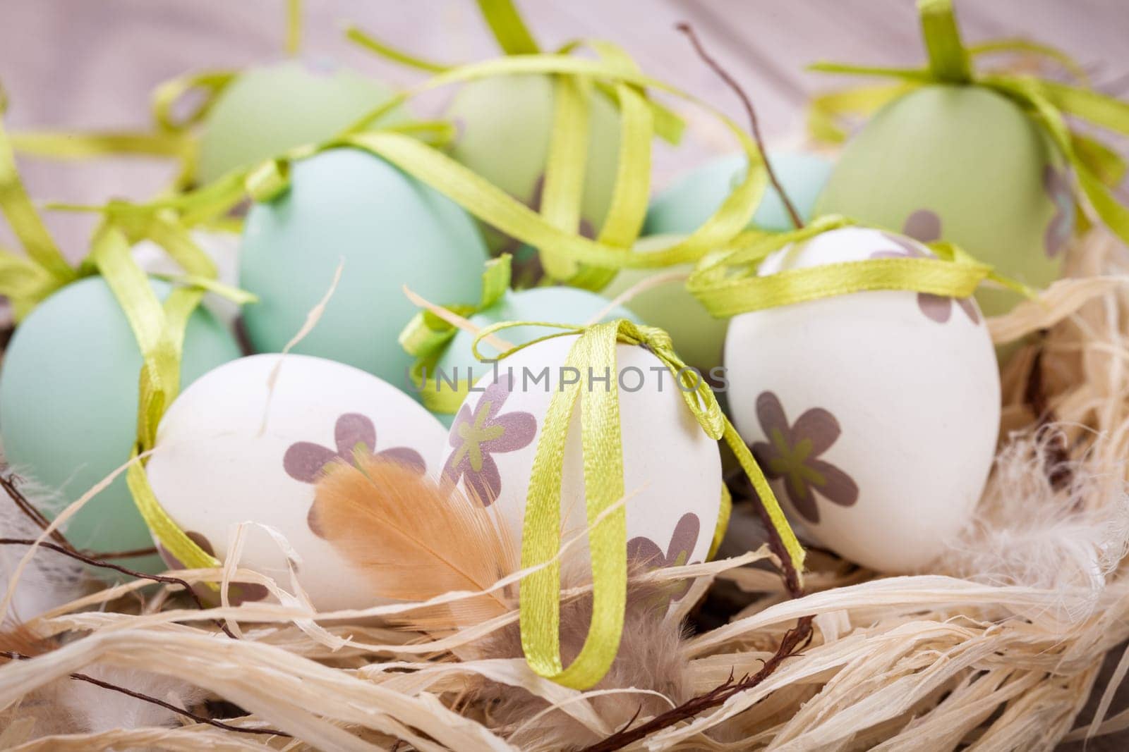 colorful green painted easter egg decoration easter bruse festive wooden table
