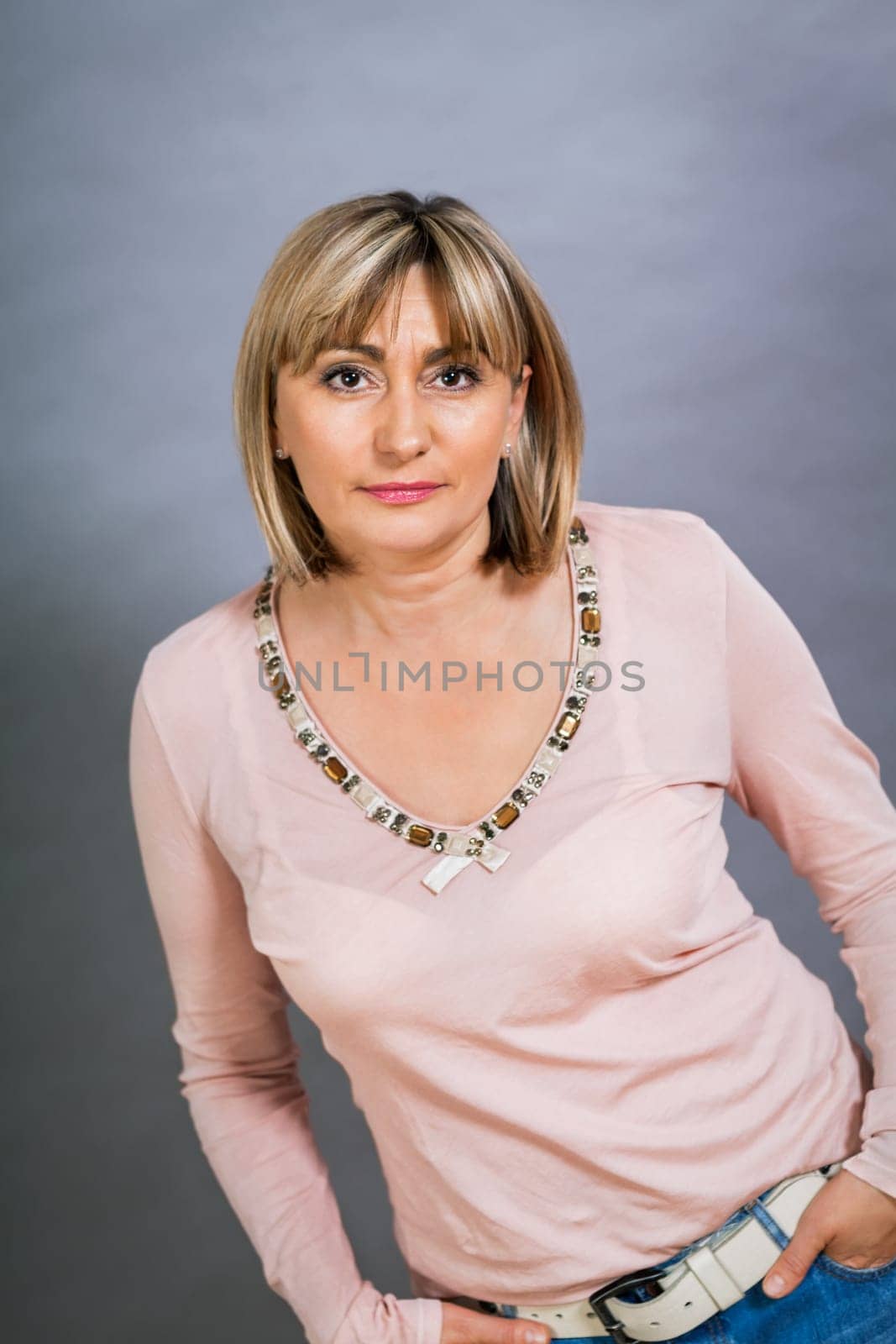 adult attractive woman in middle age portrait against gauem background