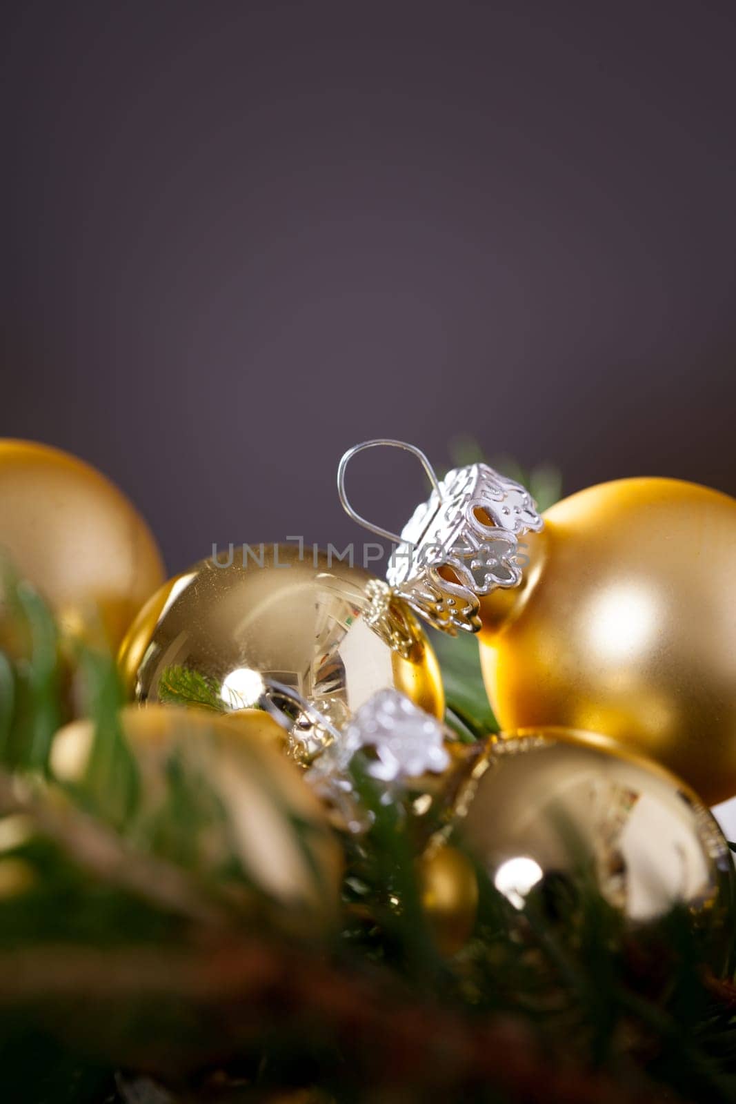 Golden shiny Christmas tree decoration Advebtsschmuck on green fir branches as close-up