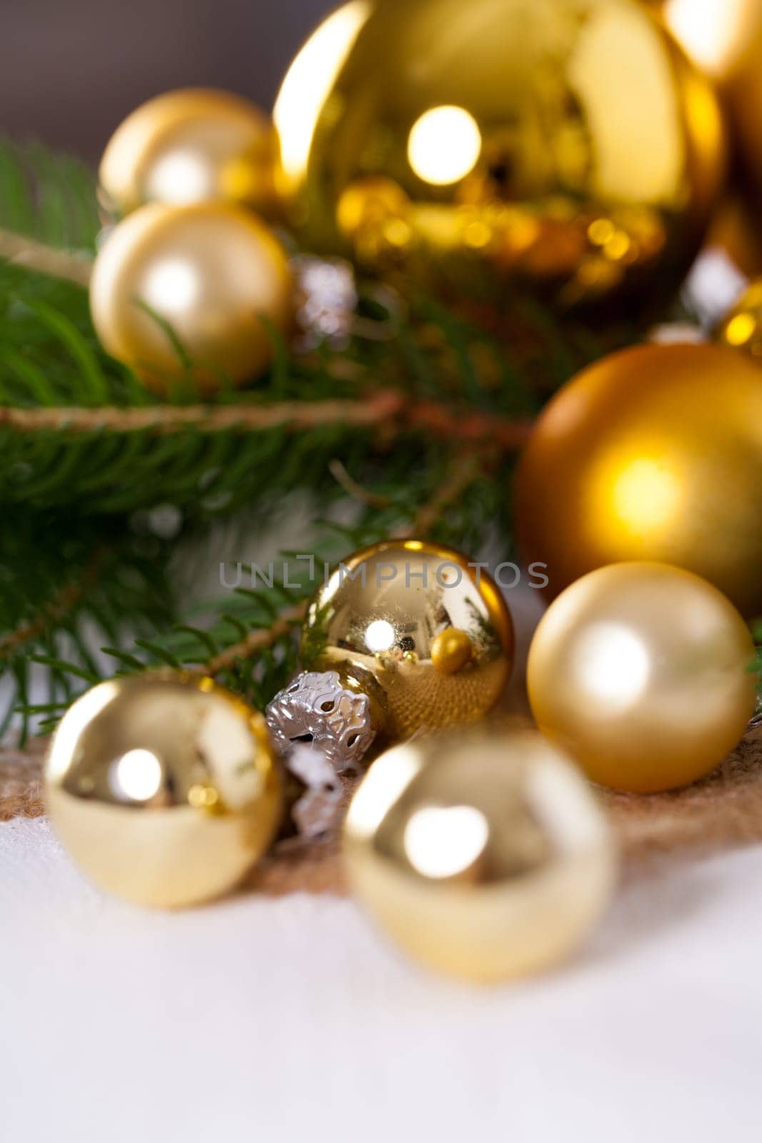 Golden shiny Christmas tree decoration Advebtsschmuck on green fir branches as close-up