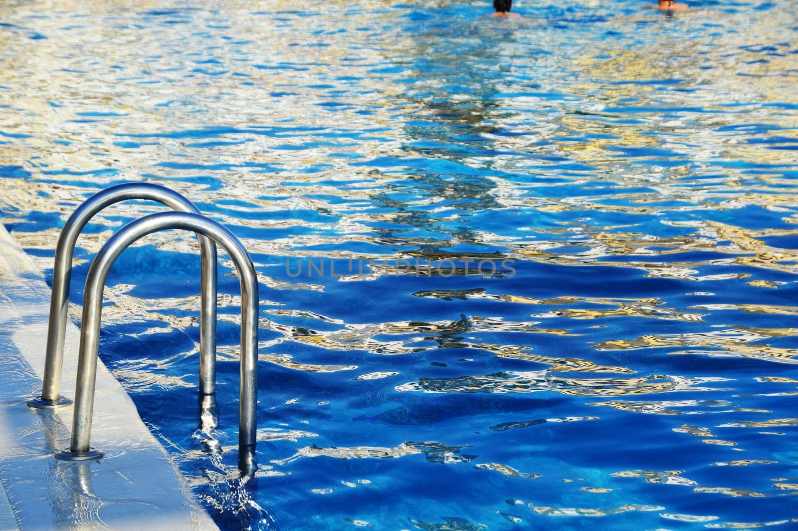 Swimming pool in touristic resort during summer time