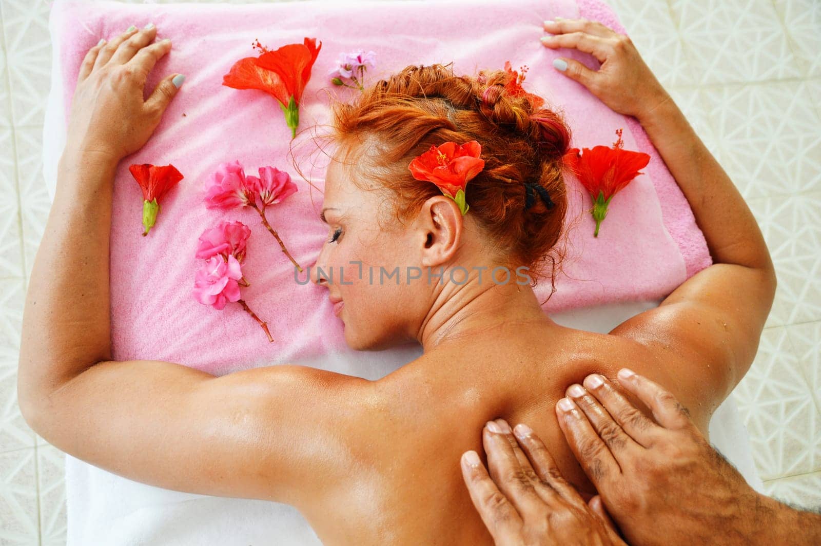 Beautiful young woman getting professional spa massage