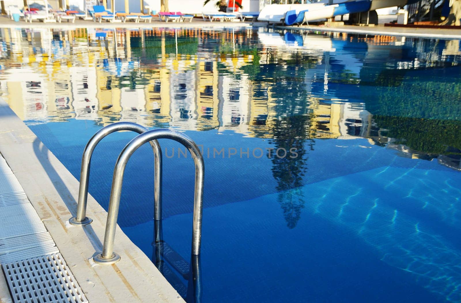 Swimming pool in touristic resort during summer time