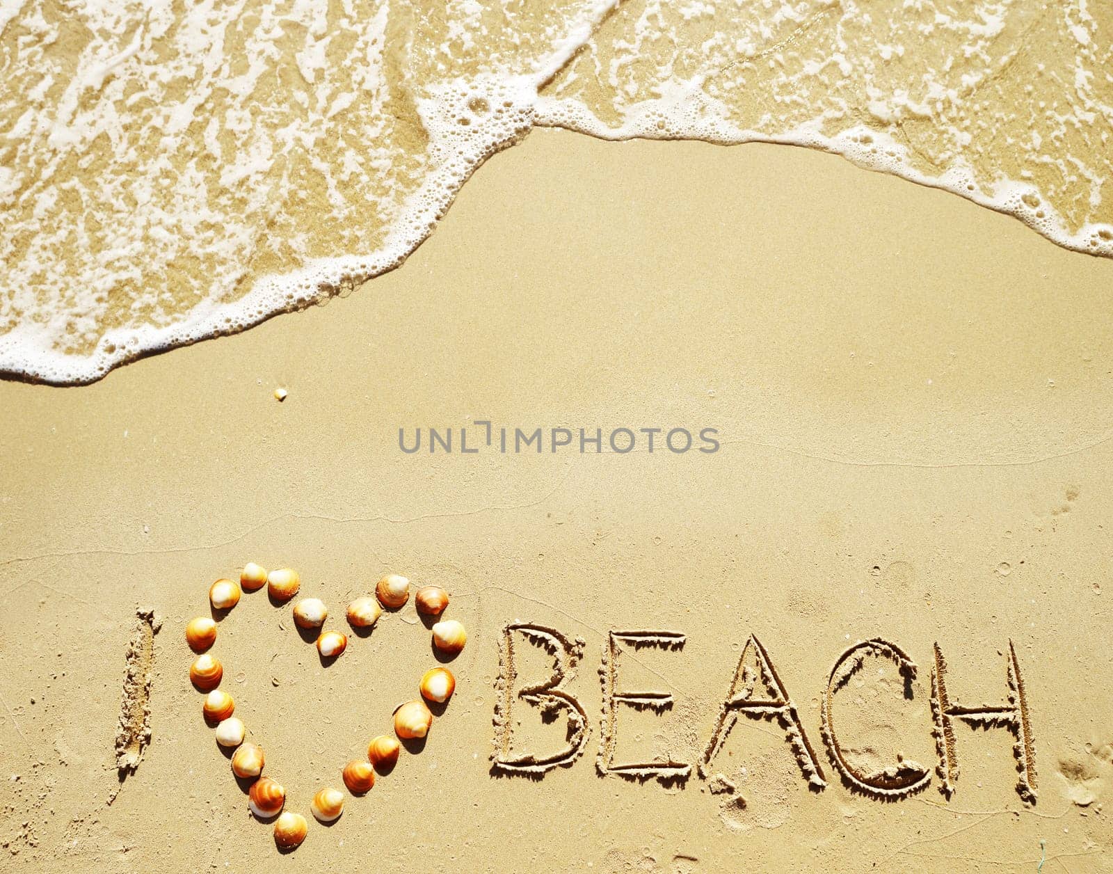 I love beach written on the sand