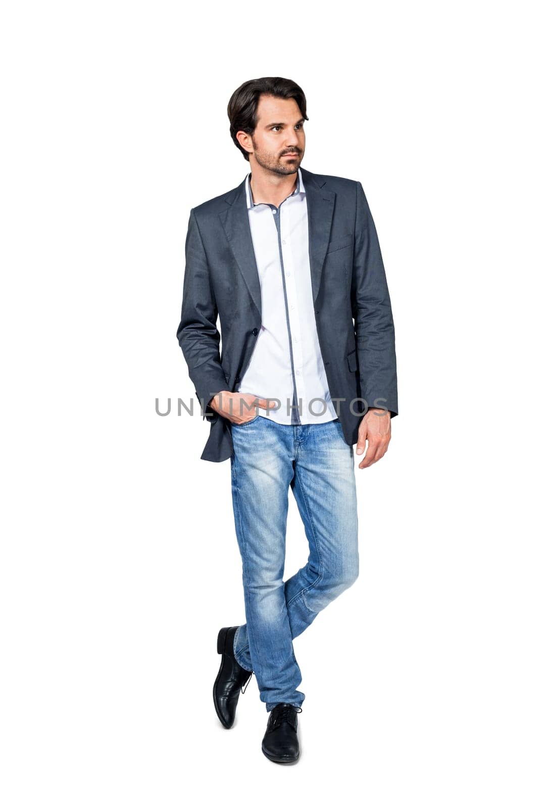 Self-proclaimed man in casual clothes with dark hair and beard isolated against a white background