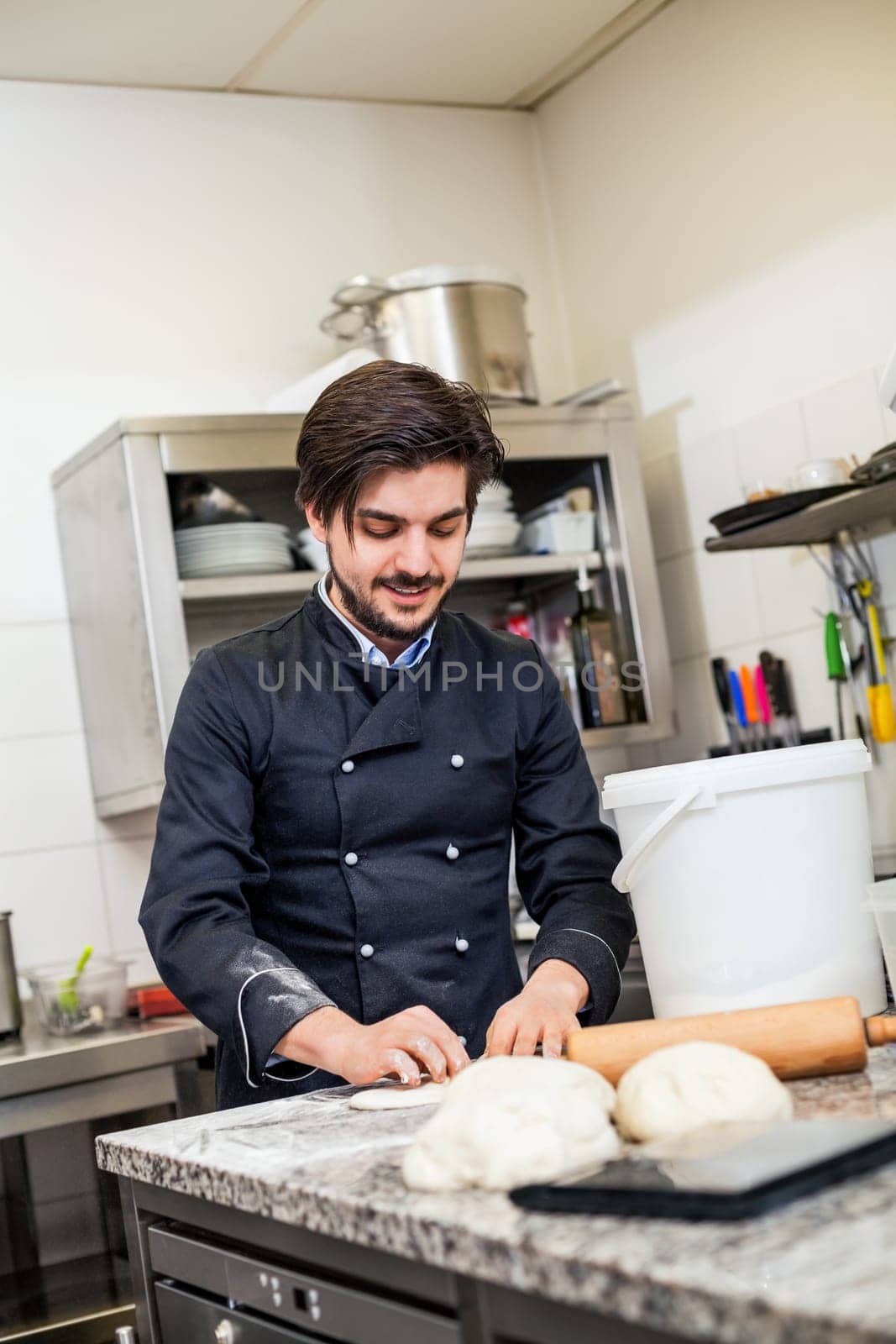 young chef throwing dough pizzadough pizza baker in the restaurant kitchen