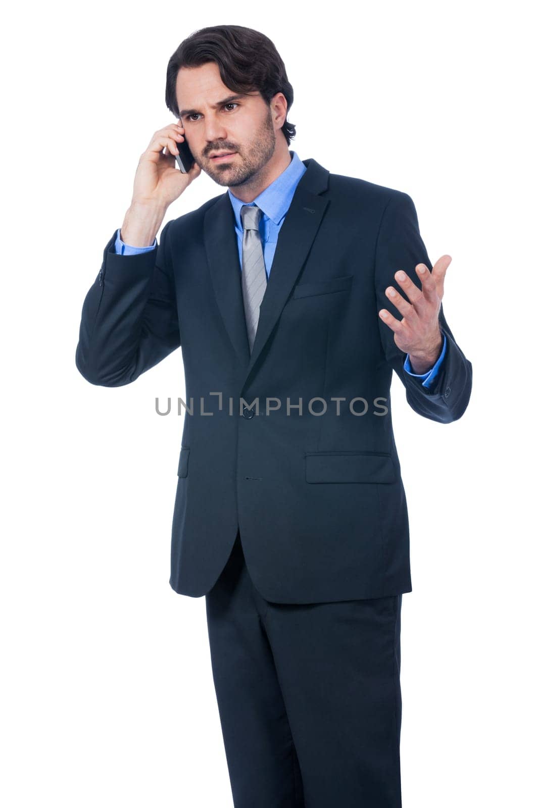 Young businessman with smartphone with dark hair and beard isolated against white background
