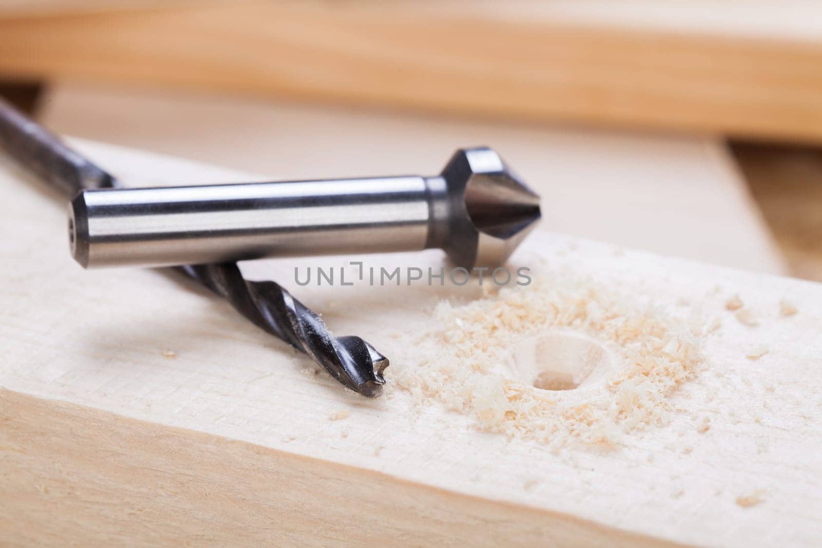 Cordless screwdriver in a carpentry shop with drill and sinker as a detailed recording for do-it-yourselfers