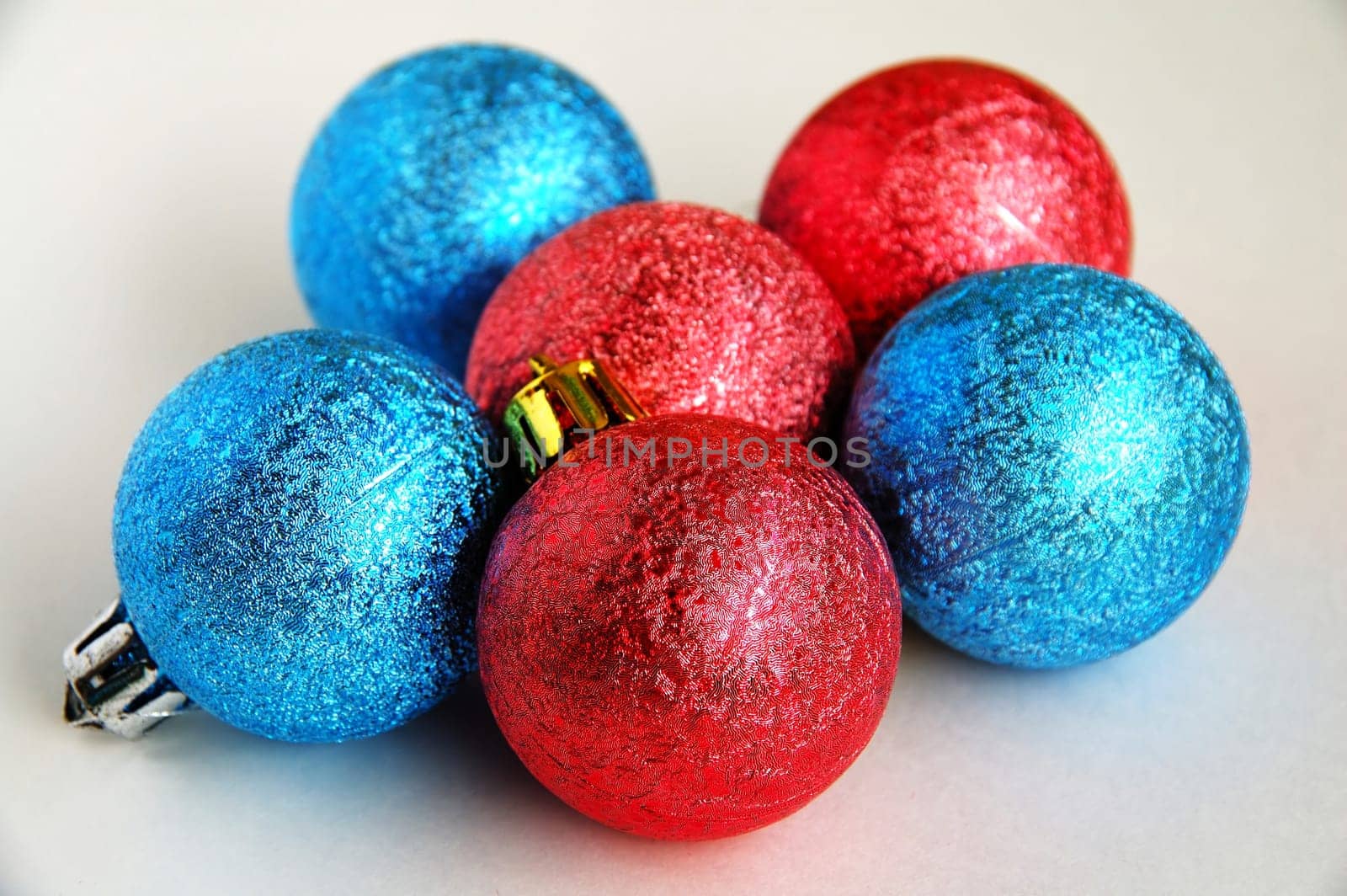 Six red and blue christmas blubs on white background