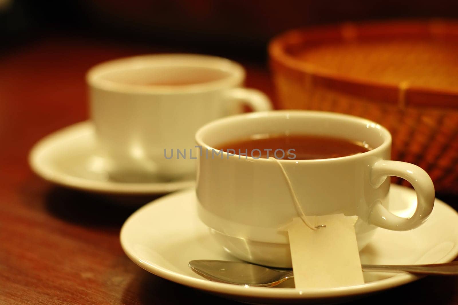 Two tea-cups and handmade basket
