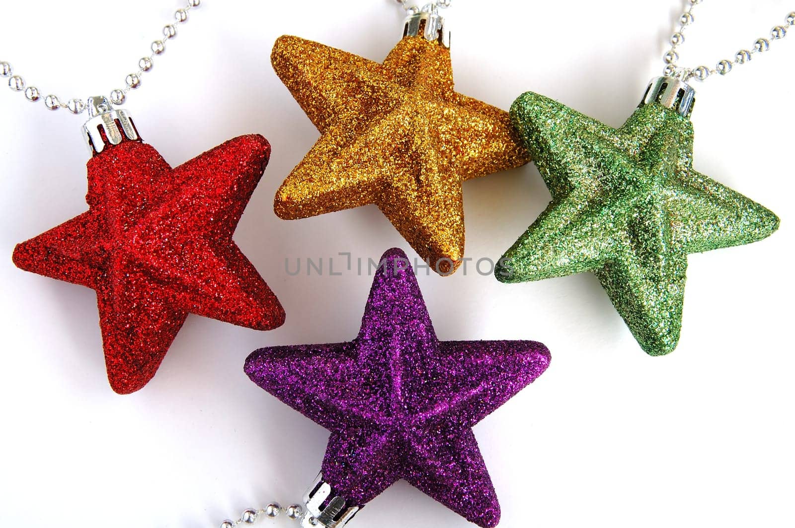 Four colorful christmas ornamental stars with white background