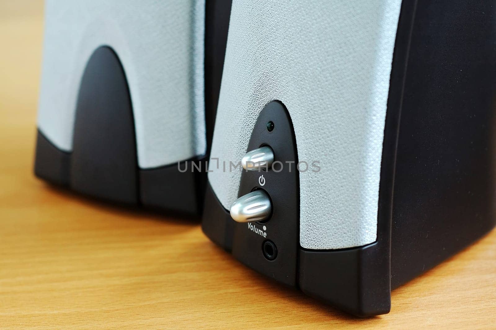 A pair of computer speakers on desk