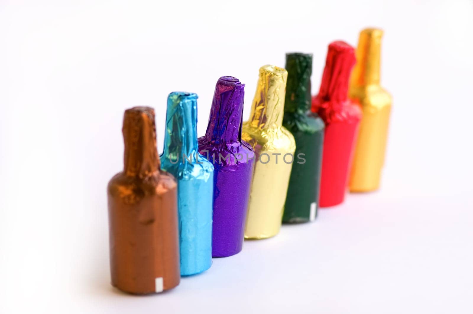 Close up view of colorful chocolate bottles