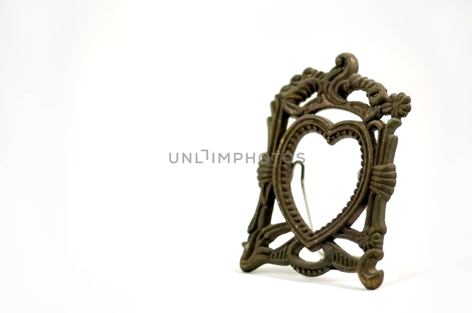 The antique photo frame isolated over white