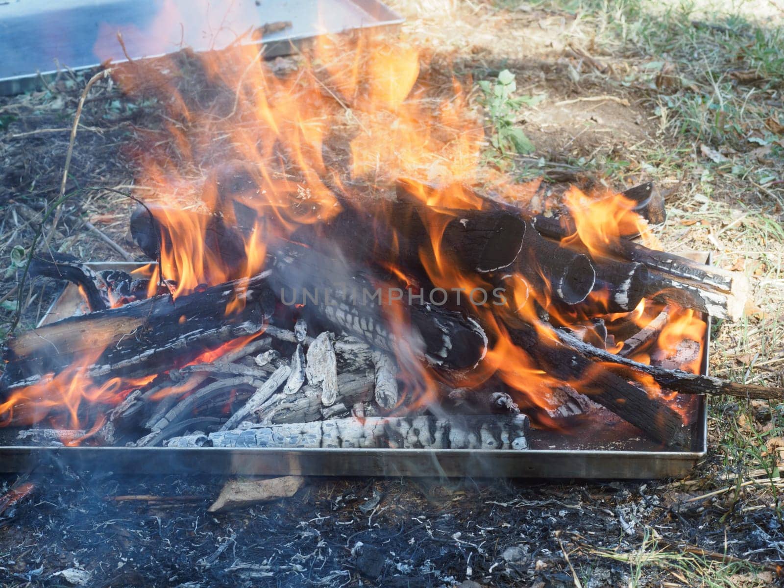 burning wood for organic charcoal produce for grilling meat outdoors