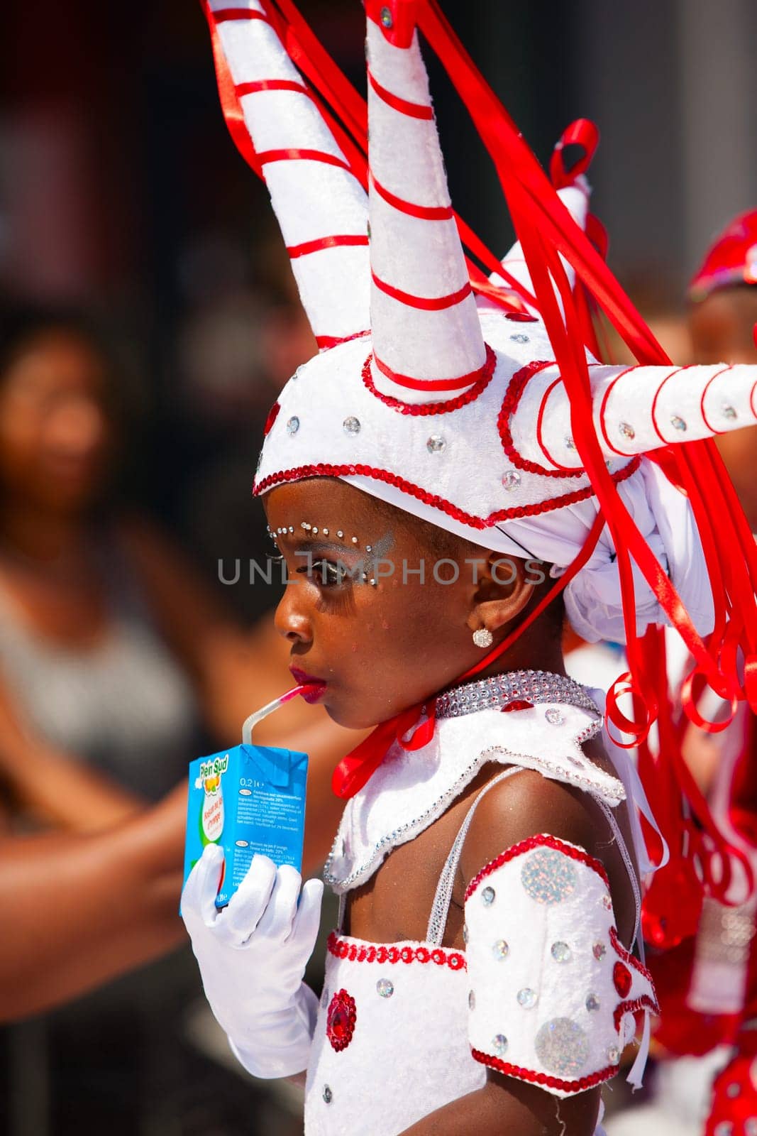 Rotterdam, the Netherlands - July 19, 2014, Young carnival dancer in the parade at the Caribbean Carnival in Rotterdam on July 19 in Rotterdam, The Netherlands.