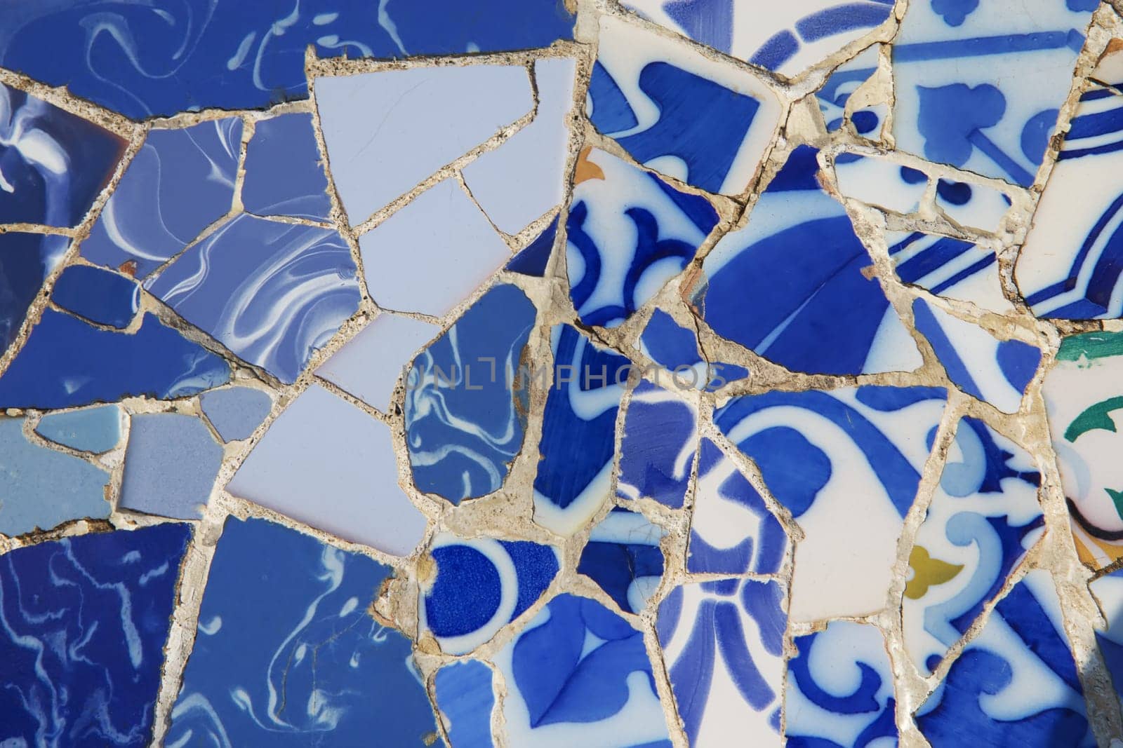 Background od the mosaic of pieces of blue color porcelain