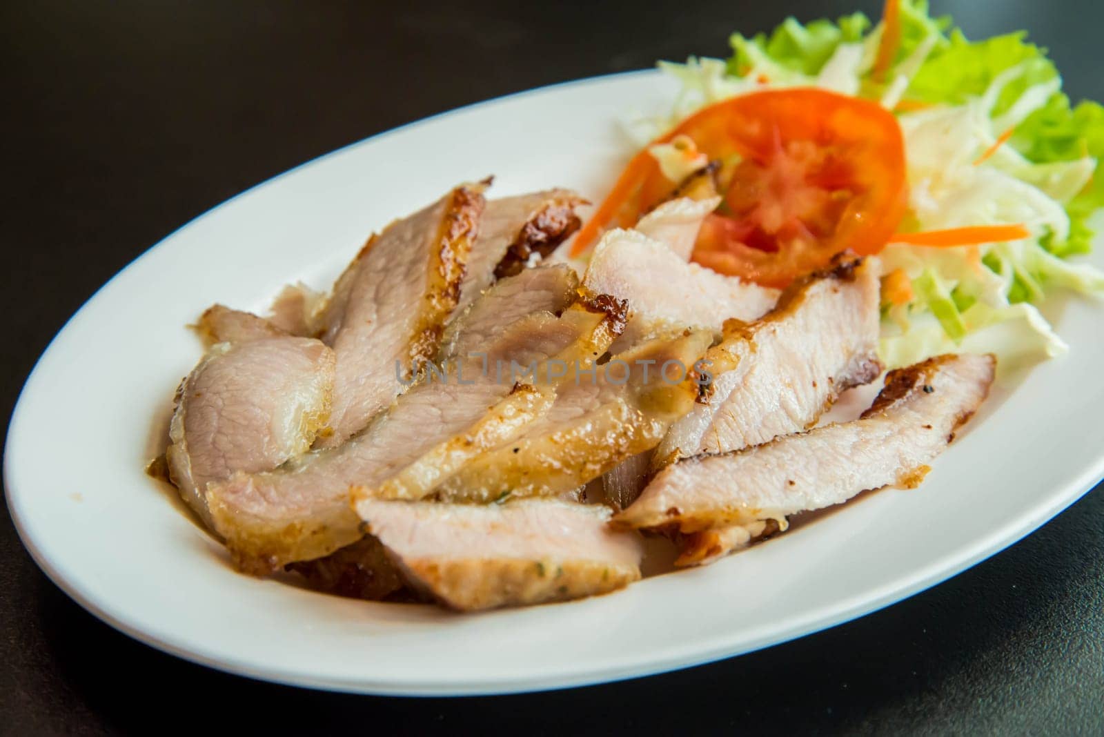 Roasted pork on the table in the restaurant.