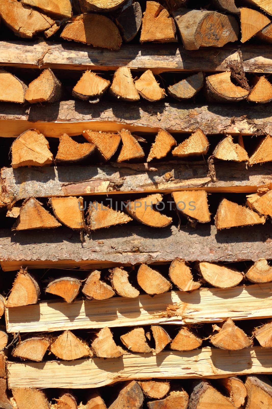 Close up on vertical placed pile of fire wood in vertical