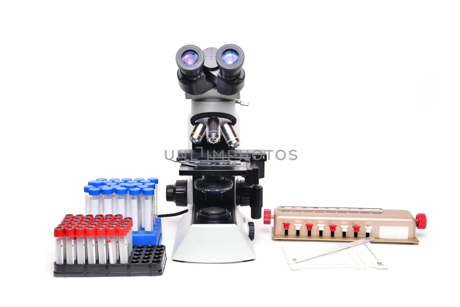microscope with laboratory equipment on white background
