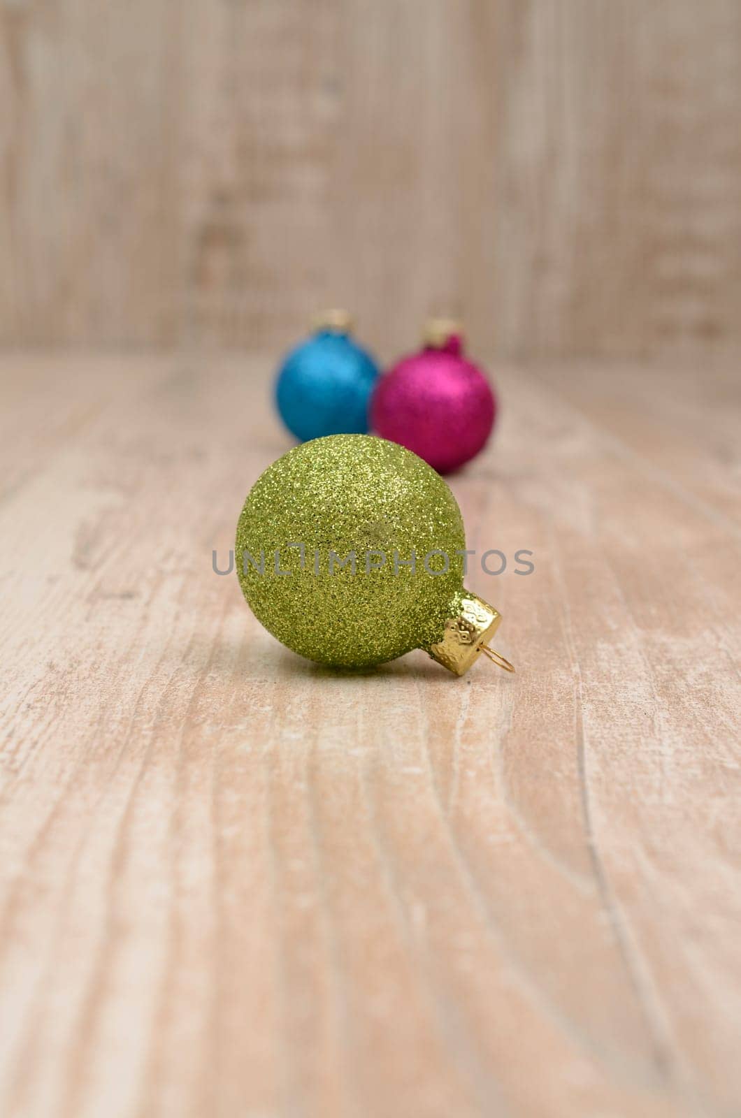 Christmas baubles on a rustic wooden background