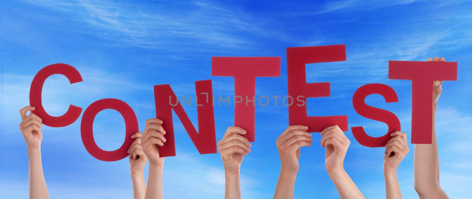 hands holding four pieces of a puzzle with copy space, gray background
