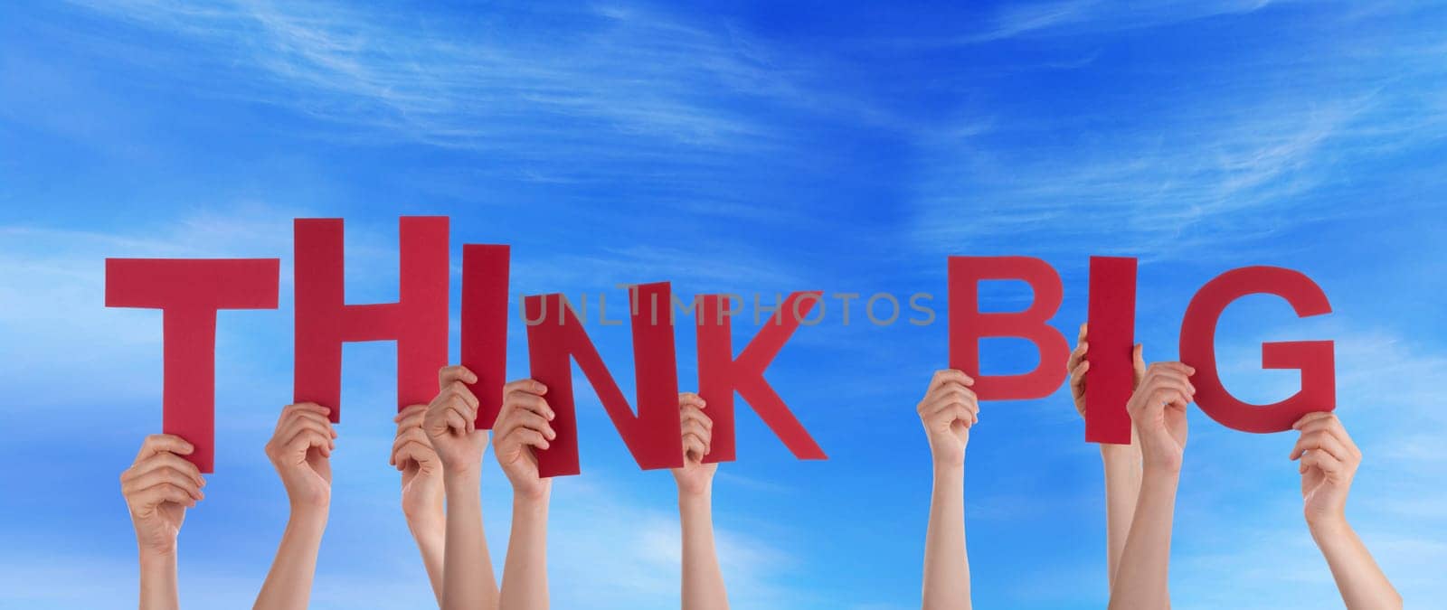 hands holding four pieces of a puzzle with copy space, gray background