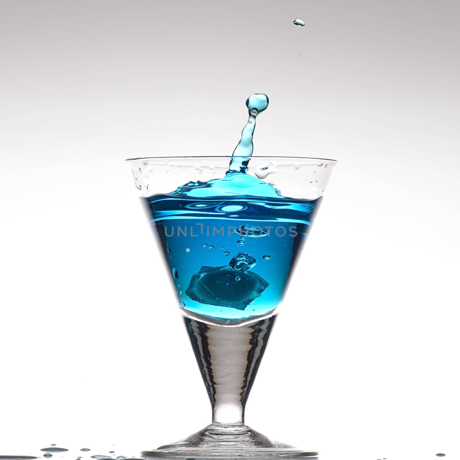 Splashing blue cocktail