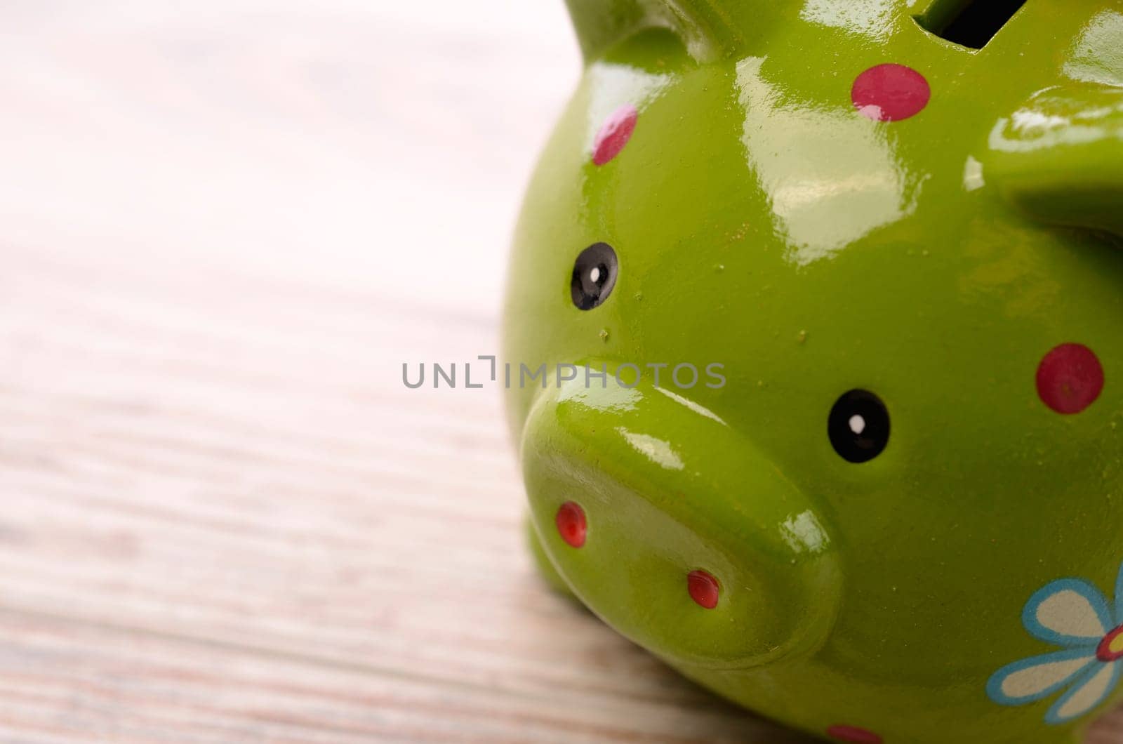 Closeup of a green piggy bank