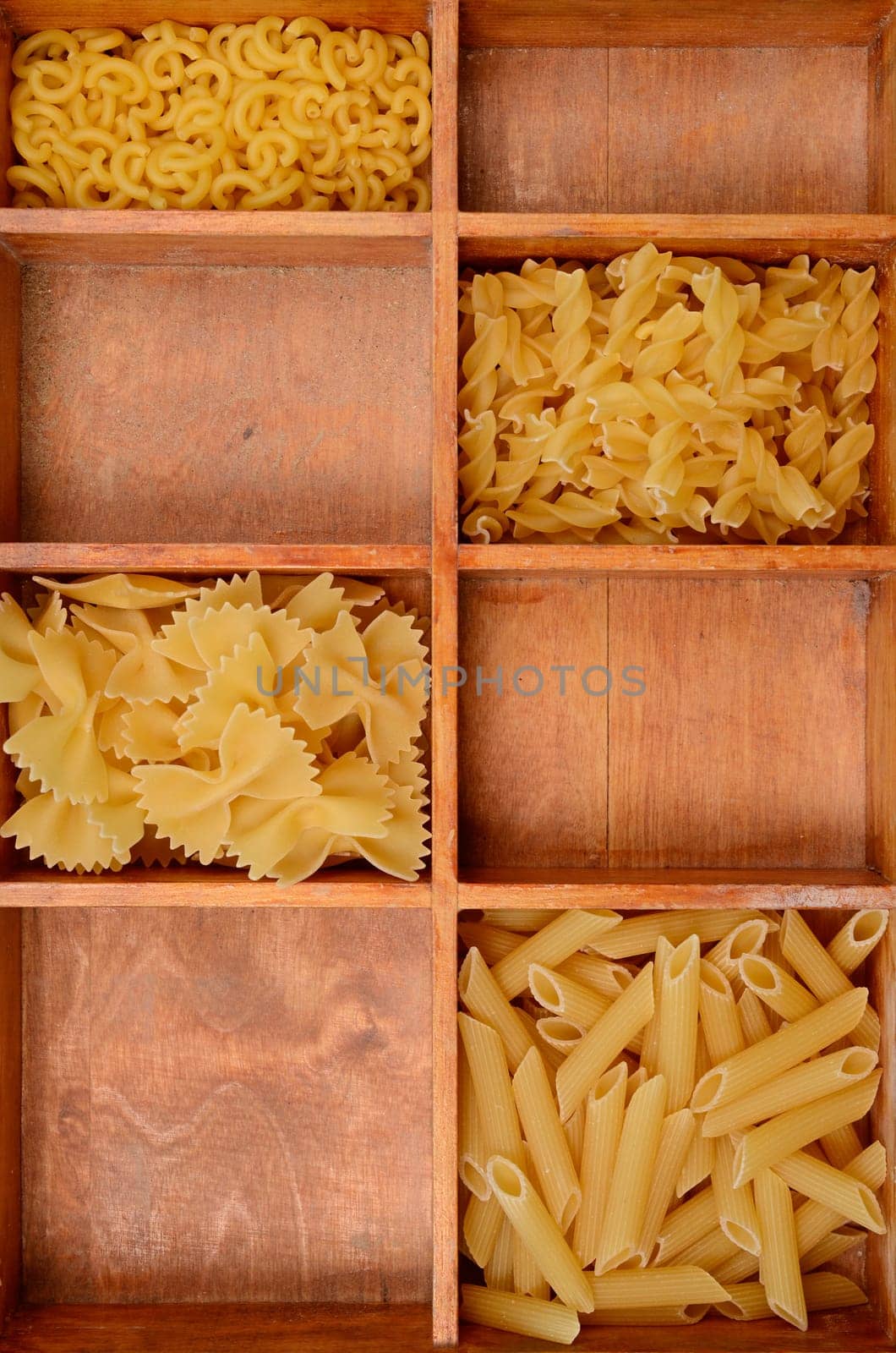 Old wooden box with pasta ingredients